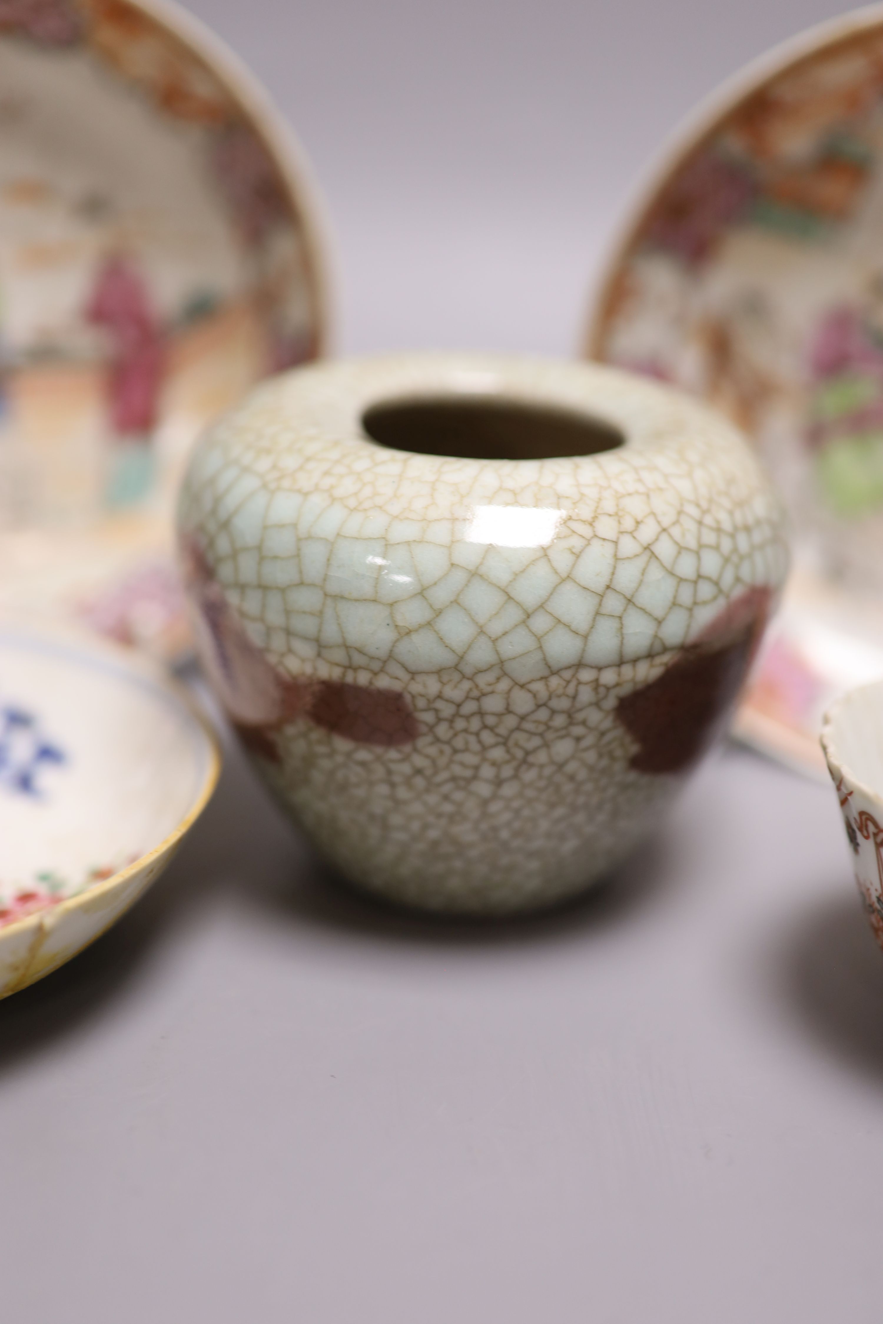 A pair of Chinese famille rose saucers, another saucer, three various tea bowls and a crackleglaze vase (7)